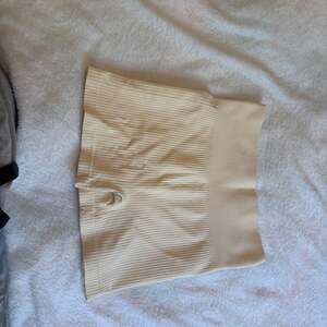 OQQ Seamless Ribbed High-Waisted Bike Shorts in Cream
